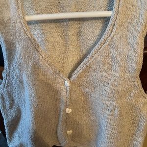 Who could refuse this adorable hand knit wool vest with cute heart buttons!